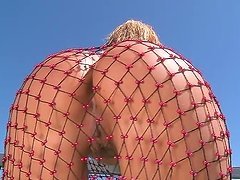 Sandy the stunning blonde babe in fishnet bodysuit in solo video