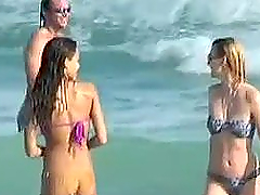 Jessica Alba wearing a purple bikini gets caught on voyeur's cam on a beach
