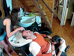 Yummy Brunettes Serve A Blowjob To A Guy While He Gets His Hair Done