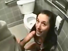 Brunette hussy enjoys ardent upskirt sex in a toilet