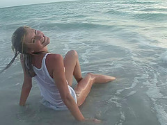 Amateur blonde teen naively poses in Wet T-shirt on the beach