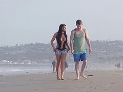 Young couple takes a walk on the beach and stops for a outdoor fuck
