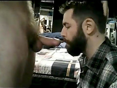 Bearded guy gets facefucked by big curved cock and swallows all the cum.