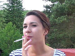Beauty smokes before she masturbates outdoors on cam