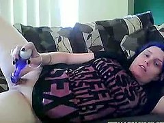 Blue hair teen masturbates on sofa