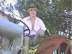 Cowgirl wife on the tractor smiles as she shows her cunt upskirt