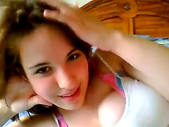 Watch this sexy brunette teen spreading her legs on bed and masturbating her pussy